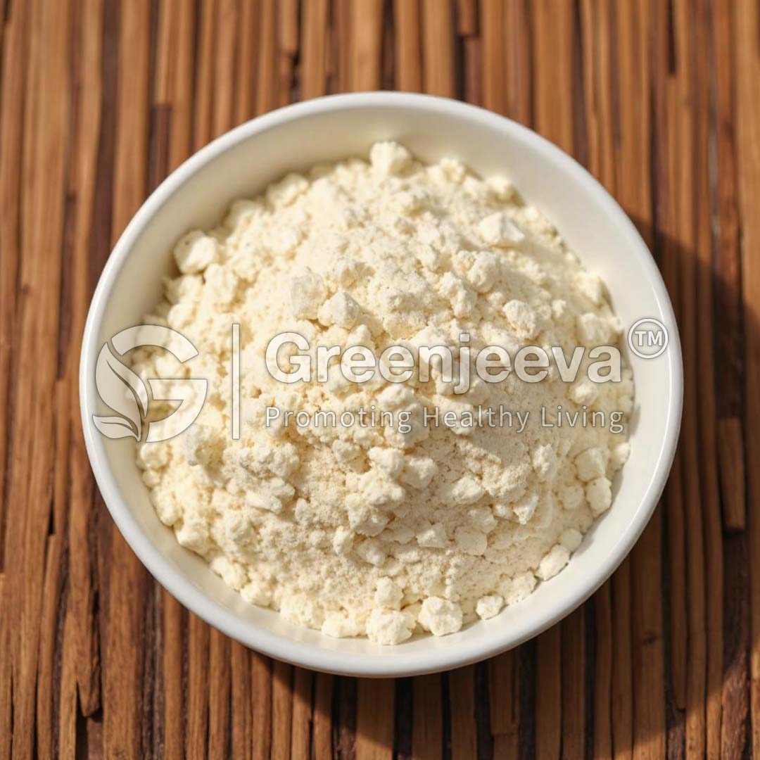 A bowl filled with finely ground, light-colored flour, Macela Leaf Extract Powder 4:1 sitting on a wooden surface, labeled "Greenjeeva - Promoting Healthy Living."