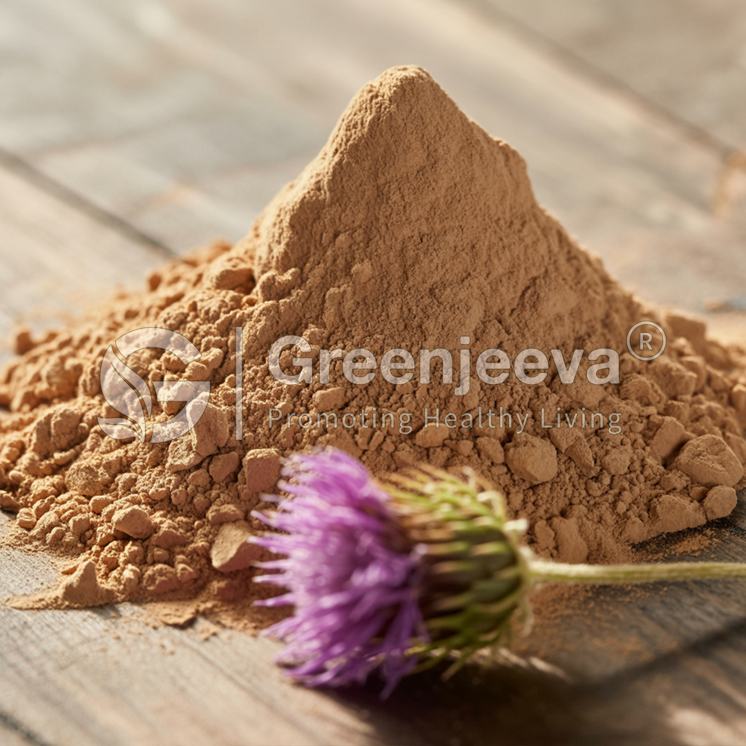 A mound of Organic Milk thistle Extract Powder with a blooming purple thistle flower nearby, set on a rustic wooden surface.